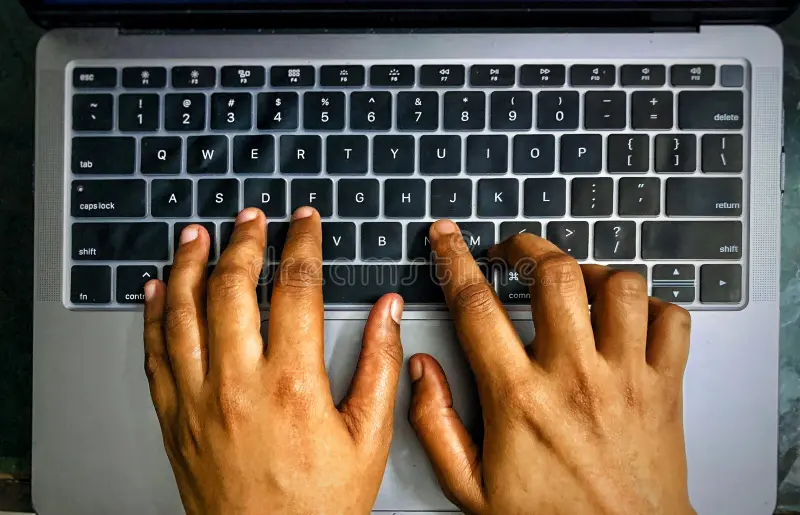 persons hands on a keyboard